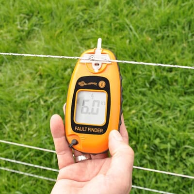 Holding a Gallagher Fault Finder for accurate readings 